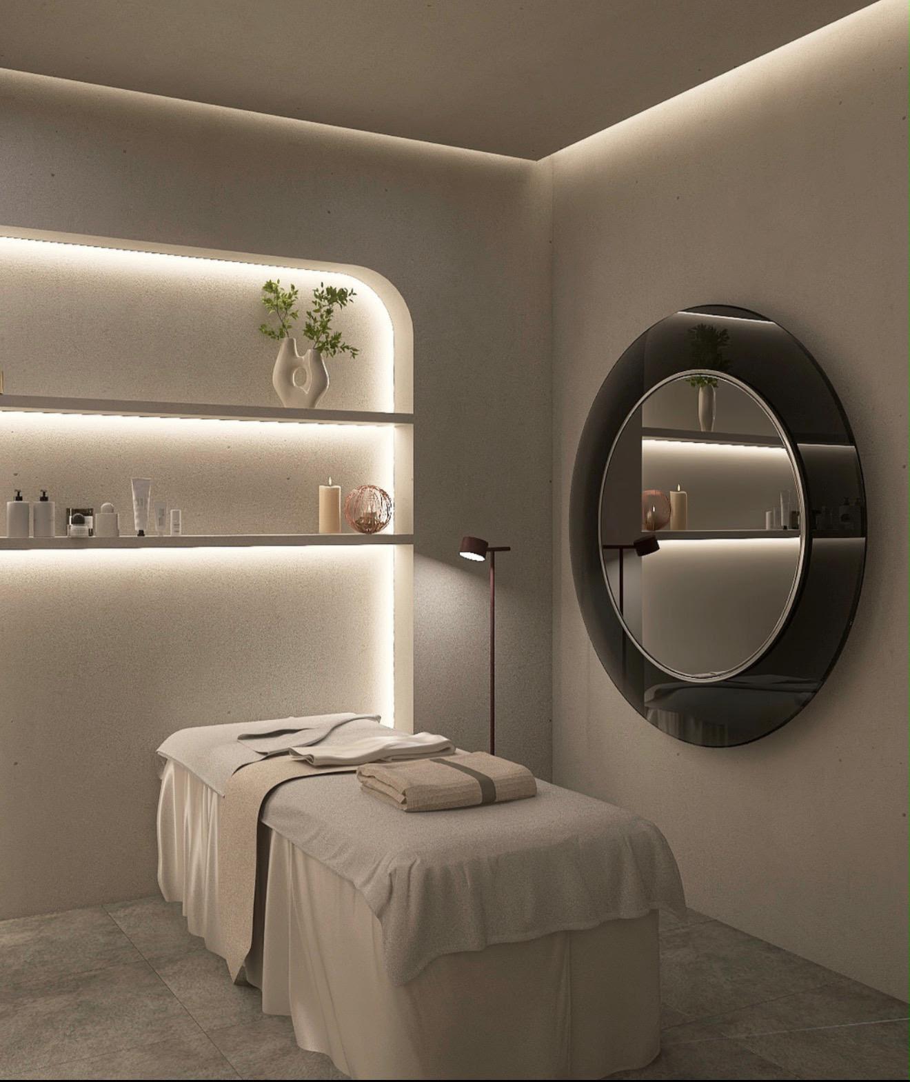 Cabina estetica con lettino trattamenti, nicchia illuminata e specchio tondo